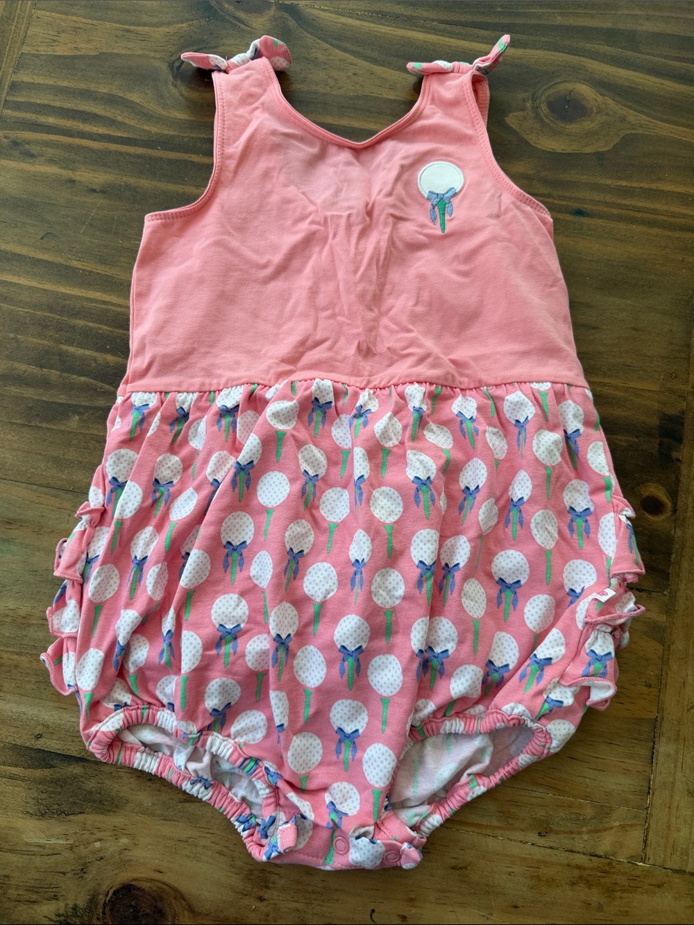 RuffleButts Coral Pink Toddler Romper with Printed Skirt